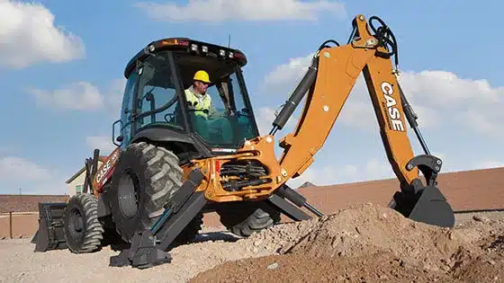 case-backhoe-main CASE Backhoe digging in dirt